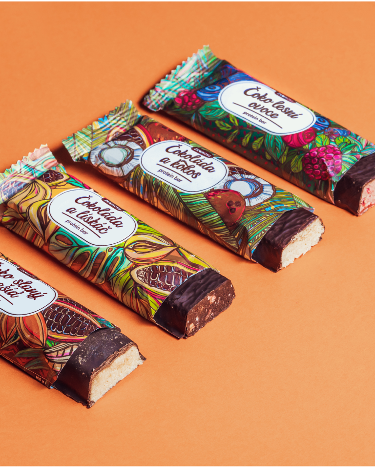 Photo of four illustrated packages of different types of protein bars with fruits and nuts, diagonal composition, bars are half-opened and cut. Orange background.